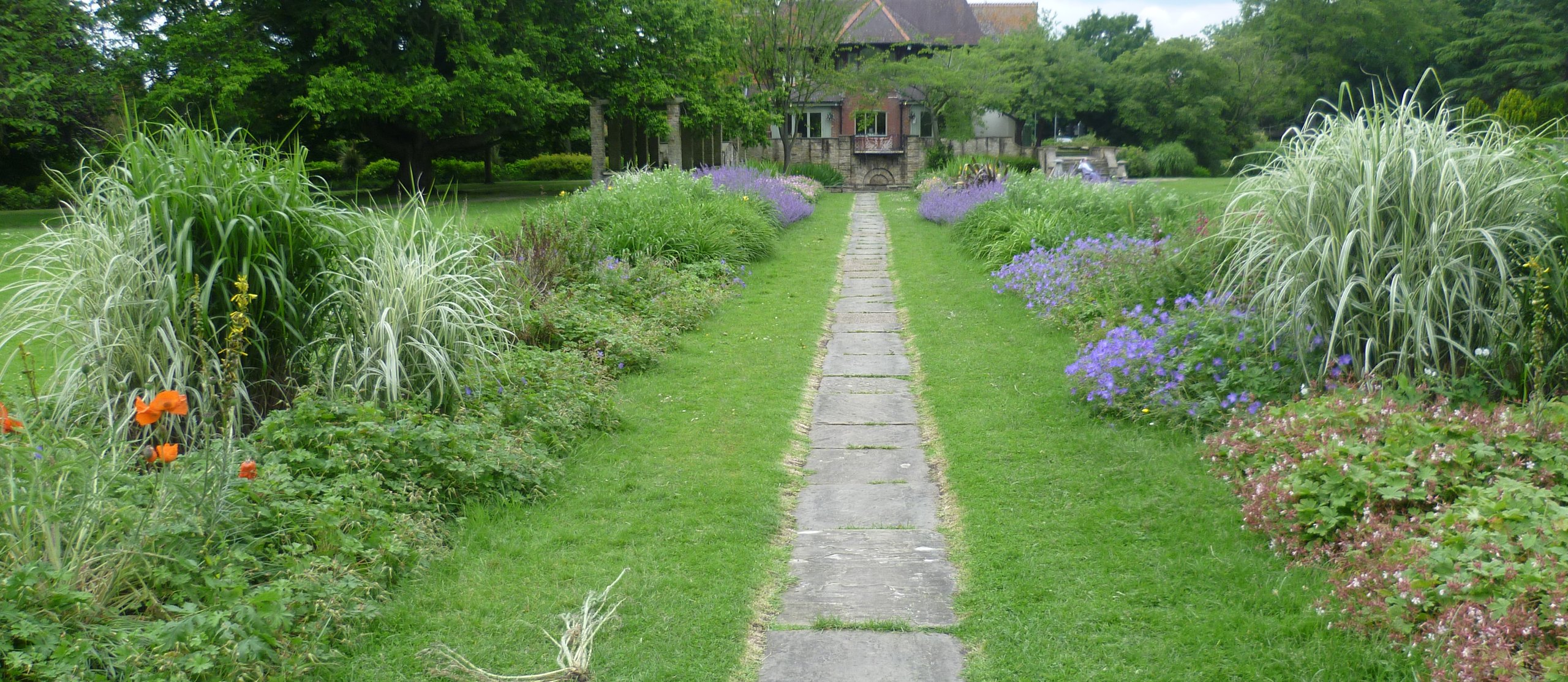 Flower borders along the path in the Grange Gardens, Beddington Park