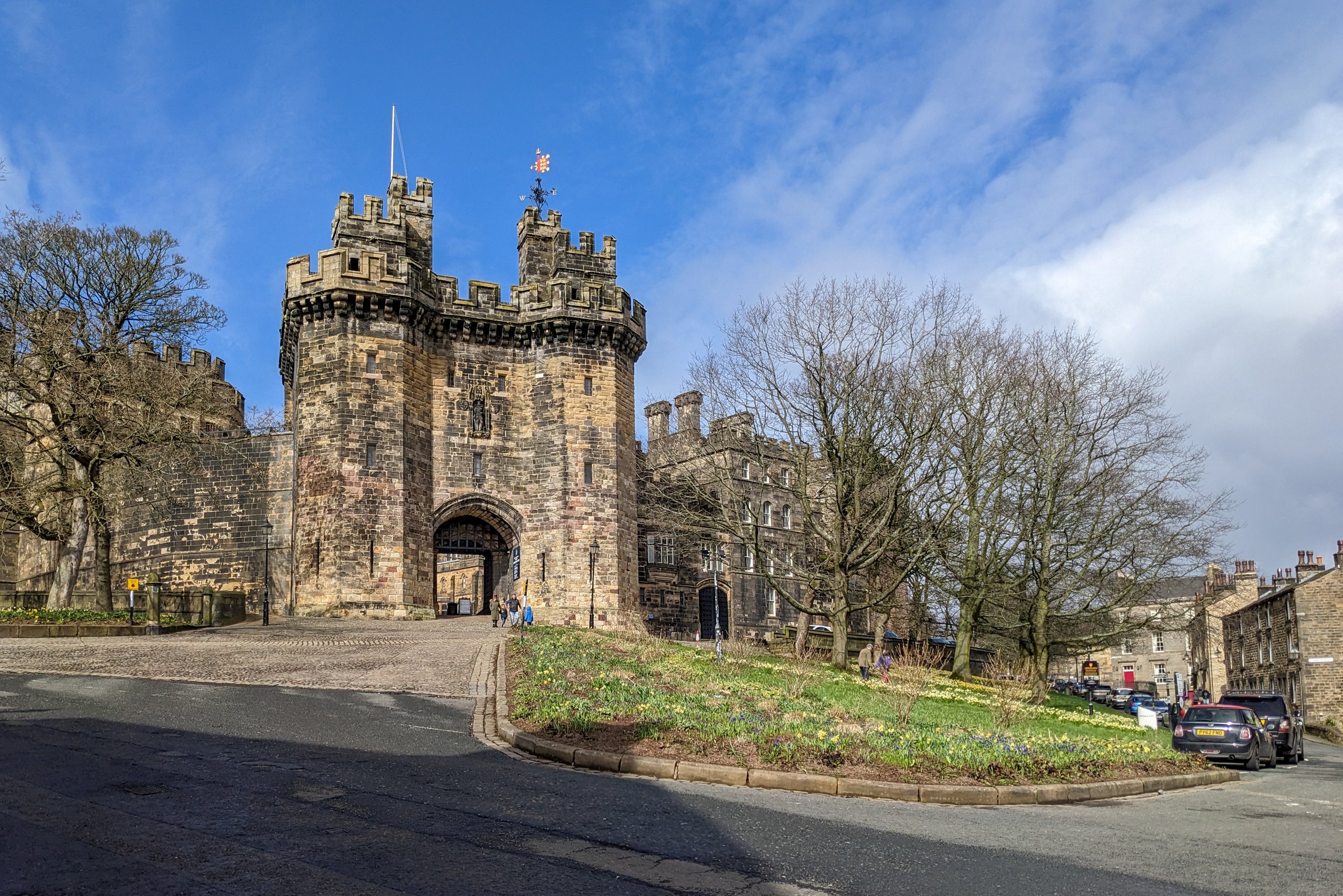 Lancaster Castle gatehouse under a blue sky