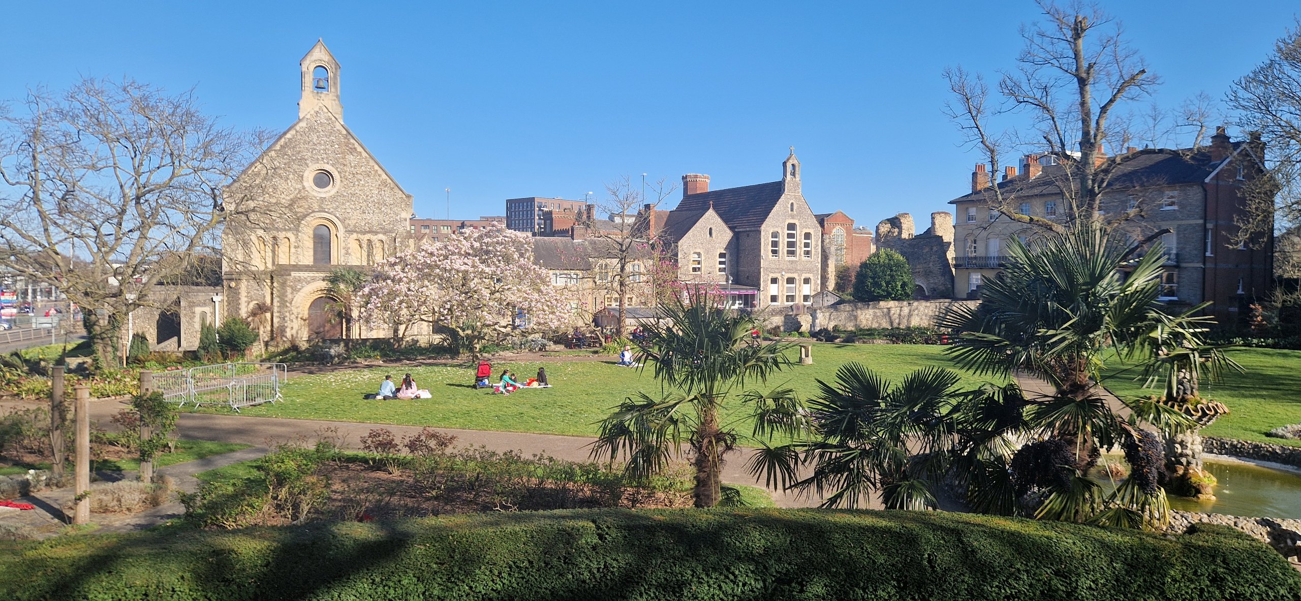 Forbury Gardens in Reading with the old abbey buildings on a sunny day