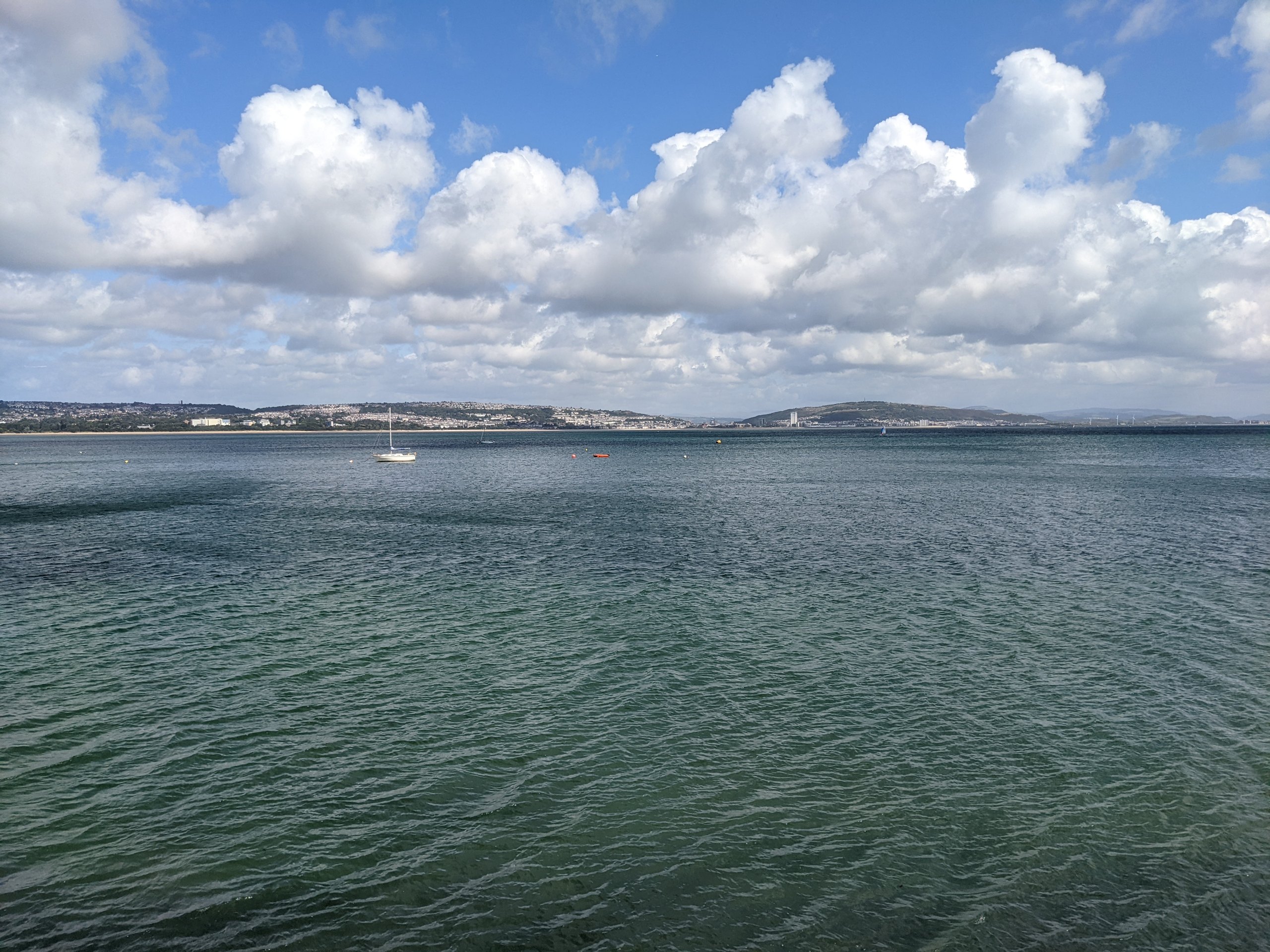 Swansea Bay seen from Mumbles under summer clouds